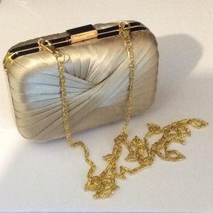 Gold clutch with detachable gold chain strap